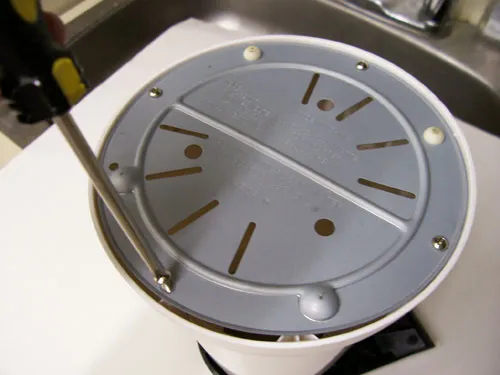 Remove screws from base of popper