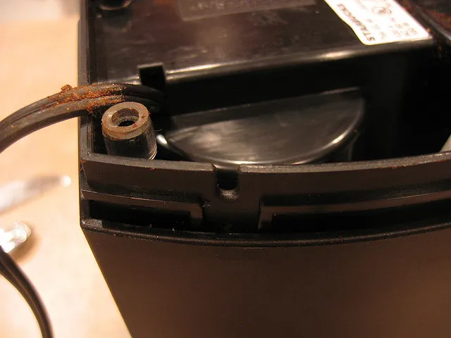 Remove the black grinder housing