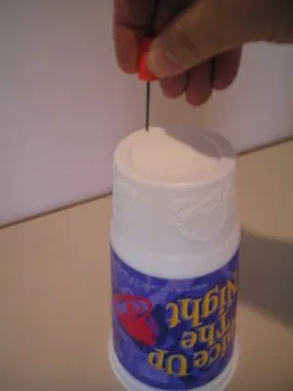 Using the drill on the cup.
