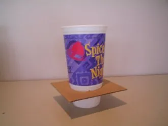 Cup inside the cut out cardboard