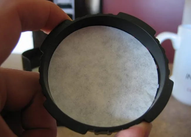 add paper filter to aeropress cap