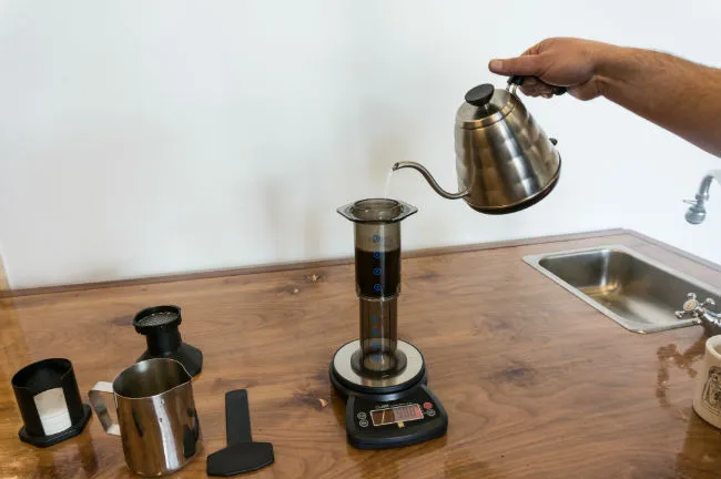 Pour hot water AeroPress coffee