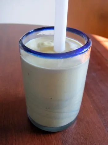 avocado coffee shake with wide straw