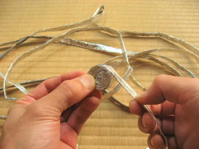 Make a tight roll of foil