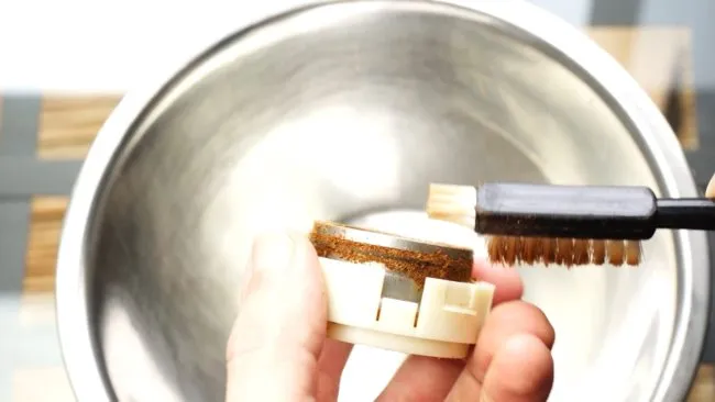 brush outer burr to clean grinder