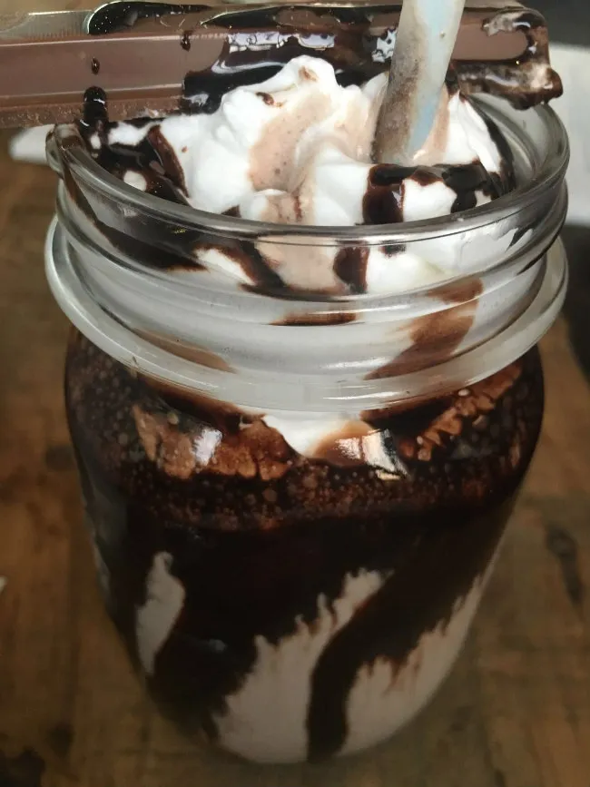 coffee shake topped with icecream and chocolate syrup