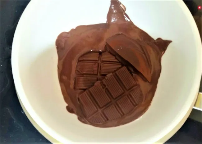 Melt chocolate for covered espresso beans.