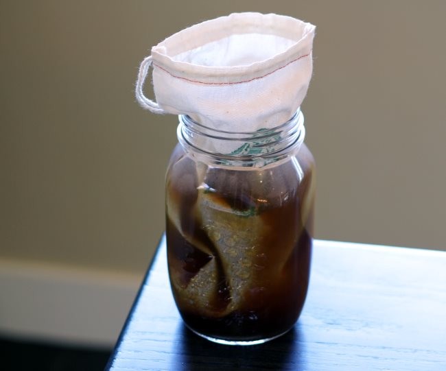 Add water to coffee grounds